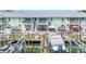 Exterior of waterfront property with multiple balconies, boat docks, and boat lifts at 5037 Starfish Se Dr # A, St Petersburg, FL 33705