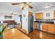 Open-concept kitchen featuring stainless steel appliances, dark wood floors, and granite countertops at 5037 Starfish Se Dr # A, St Petersburg, FL 33705