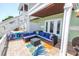 Relaxing outdoor patio with cozy seating and vibrant decor, perfect for enjoying the tranquil waterfront ambiance at 5037 Starfish Se Dr # A, St Petersburg, FL 33705