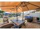 Charming outdoor patio with comfortable seating and a grilling area, ideal for waterfront dining and relaxation at 5037 Starfish Se Dr # A, St Petersburg, FL 33705