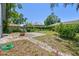 A cozy backyard featuring a brick-paved area and greenery at 5806 N 9Th St, Tampa, FL 33604