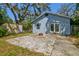 Backyard patio showing home and storage building at 5806 N 9Th St, Tampa, FL 33604