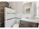 Updated bathroom with a modern sink and vanity, toilet, and tiled shower at 5806 N 9Th St, Tampa, FL 33604