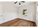 Bedroom featuring hardwood floors and an abundance of natural light at 5806 N 9Th St, Tampa, FL 33604