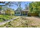 Quaint one-story home featuring a lush front lawn and inviting curb appeal in a sunny neighborhood at 5806 N 9Th St, Tampa, FL 33604
