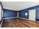 Elegant living room with hardwood floors, and tasteful blue walls and neutral trim at 5806 N 9Th St, Tampa, FL 33604