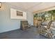 Relaxing screened porch with comfortable seating and a serene outdoor view at 5806 N 9Th St, Tampa, FL 33604