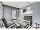 Enclosed screened porch with seating, ideal for relaxation and entertaining guests at 5806 N 9Th St, Tampa, FL 33604