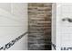 Modern shower featuring wood-look tile accent wall, and white subway tile with mosaic trim at 5806 N 9Th St, Tampa, FL 33604