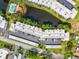 Aerial view of complex, with a red arrow indicating the location of the unit at 5980 Terrace Park N Dr # 214, St Petersburg, FL 33709