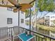 Relaxing screened balcony with seating offers serene water views and fresh air from this waterfront condo at 5980 Terrace Park N Dr # 214, St Petersburg, FL 33709
