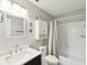 Bright bathroom featuring updated vanity, fixtures, and a shower-tub combination, blending style with functionality at 5980 Terrace Park N Dr # 214, St Petersburg, FL 33709