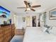 Inviting main bedroom with hardwood flooring and a ceiling fan boasts ample closet space and relaxing ambiance at 5980 Terrace Park N Dr # 214, St Petersburg, FL 33709