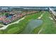 Scenic aerial view of condos, golf course, and lakefront property in a desirable community at 6171 Bahia Del Mar Blvd # 216, St Petersburg, FL 33715