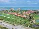 An aerial view showcases this waterfront community and golf course, with orange tile roofs at 6171 Bahia Del Mar Blvd # 216, St Petersburg, FL 33715