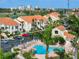 Aerial view of condos with a pool, parking, and easy access to nearby attractions at 6171 Bahia Del Mar Blvd # 216, St Petersburg, FL 33715