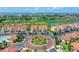 Community aerial featuring lush landscaping, golf course views, and attractive residential buildings at 6171 Bahia Del Mar Blvd # 216, St Petersburg, FL 33715