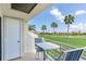 Balcony view overlooking lush green golf course and beautiful palm trees at 6171 Bahia Del Mar Blvd # 216, St Petersburg, FL 33715