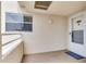 View of a balcony featuring window, wall lighting and white door at 6171 Bahia Del Mar Blvd # 216, St Petersburg, FL 33715