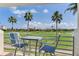 Balcony view features golf course and seating, perfect for relaxing and enjoying the scenery at 6171 Bahia Del Mar Blvd # 216, St Petersburg, FL 33715