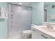 Clean bathroom featuring a shower with a sliding glass door and a bright vanity at 6171 Bahia Del Mar Blvd # 216, St Petersburg, FL 33715