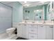Bright bathroom featuring a double vanity, an over-sized mirror, and a glass-enclosed shower at 6171 Bahia Del Mar Blvd # 216, St Petersburg, FL 33715