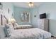 Cozy bedroom featuring two twin beds, a ceiling fan, and ample natural light at 6171 Bahia Del Mar Blvd # 216, St Petersburg, FL 33715