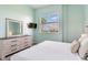 Comfortable bedroom featuring a bright window, modern dresser, and soft color palette at 6171 Bahia Del Mar Blvd # 216, St Petersburg, FL 33715
