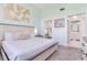Relaxing bedroom with a large window, and a glimpse into the en-suite bathroom at 6171 Bahia Del Mar Blvd # 216, St Petersburg, FL 33715