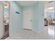 Inviting entryway featuring tile floors, blue accent walls, and easy access to nearby bedroom and kitchen at 6171 Bahia Del Mar Blvd # 216, St Petersburg, FL 33715