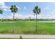 Expansive golf course view with palm trees and a smooth, winding golf cart path at 6171 Bahia Del Mar Blvd # 216, St Petersburg, FL 33715
