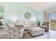 Bright living room with comfortable seating, neutral colors, and sliding glass doors to the outside patio at 6171 Bahia Del Mar Blvd # 216, St Petersburg, FL 33715