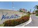 Elegant community signage with lush landscaping at the entrance of Vista Verde North at 6171 Bahia Del Mar Blvd # 216, St Petersburg, FL 33715