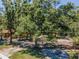 An overhead view of the backyard featuring mature trees providing shade and a spacious outdoor area at 6259 68Th N Ter, Pinellas Park, FL 33781