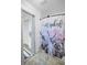 Unique bathroom showcasing whimsical decor, tile floors, and a shower at 6259 68Th N Ter, Pinellas Park, FL 33781
