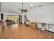 Bright living room with hardwood floors and access to a screened outdoor area at 6259 68Th N Ter, Pinellas Park, FL 33781