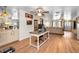 Spacious living room with wood floors, ceiling fans, and modern decor at 6259 68Th N Ter, Pinellas Park, FL 33781