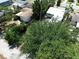 A high-angle captures the property's landscaped surroundings, complementing the single-story home with an adjacent garage at 627 64Th S Ave, St Petersburg, FL 33705