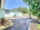 Large brick-paved backyard patio provides a great outdoor space for relaxing and entertaining at 627 64Th S Ave, St Petersburg, FL 33705