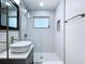 Bright, modern bathroom with vessel sink, glass shower, and stylish fixtures at 627 64Th S Ave, St Petersburg, FL 33705
