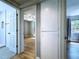 View of bedroom through doorway with wood floors, neutral walls, fan and window at 627 64Th S Ave, St Petersburg, FL 33705