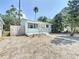 Charming single-story home with a well-manicured front yard and a quaint front porch at 627 64Th S Ave, St Petersburg, FL 33705
