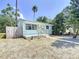 Charming single-story home with a well-manicured front yard and a quaint front porch at 627 64Th S Ave, St Petersburg, FL 33705
