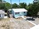 Charming home with metal roof, quaint porch, and tidy landscaping at 627 64Th S Ave, St Petersburg, FL 33705