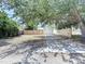 Backyard view featuring a garage with a new wooden fence for added privacy at 627 64Th S Ave, St Petersburg, FL 33705
