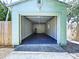 Exterior view of garage with epoxy floor and open door at 627 64Th S Ave, St Petersburg, FL 33705