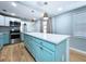 Kitchen featuring a large center island, stainless steel appliances, and lots of cabinets at 627 64Th S Ave, St Petersburg, FL 33705