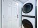 Convenient laundry area with new stacked washer and dryer units at 627 64Th S Ave, St Petersburg, FL 33705