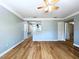 Living room features updated laminate flooring, neutral paint, and abundant natural light, creating a welcoming space at 627 64Th S Ave, St Petersburg, FL 33705