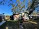 Wide angle shot of the backyard, featuring some outdoor furniture, a grill, and partial fencing at 701 54Th S St, Gulfport, FL 33707